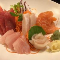 Tuna Carpaccio · Thin sliced served in a yuzu sauce and lightly sizzled with hot oil served with rice salad a...