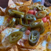 Dockside Double Cheese Nachos · Mixed cheeses, jalapeños and tomatoes.