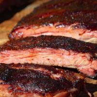 1 Lb St. Louis Pork Ribs · Slowly smoked to perfection in specialized wood-burning 