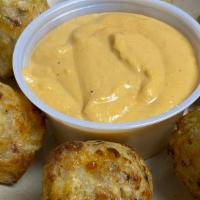 Jumbo Tater Tots · Stuffed with bacon, sour cream, chives and served with craft beer cheese sauce