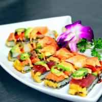 Sushi Pizza · Thin rice & nori tempura topped with sashimi, avocado, tomatoes, jalapenos, eel and spicy ma...