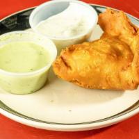 Samosa · Served with mint/green sauce.