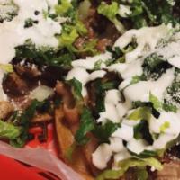 #9. Tostadas (3) · Crunchy hard flat corn tortilla with beans, lettuce, onions, sour cream & Queso Cotija serve...