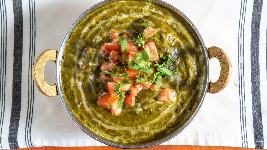 Saag Paneer · Paneer cubes cooked in a creamy spinach sauce.