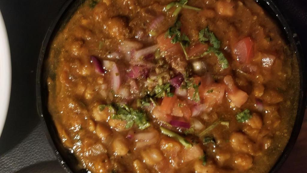 Channa Masala · Chickpeas cooked with chopped ginger, garlic, onions, tomato and ground spices.