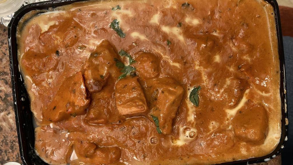 Butter Chicken · Chicken cubes cooked in creamy, buttery tomato sauce.