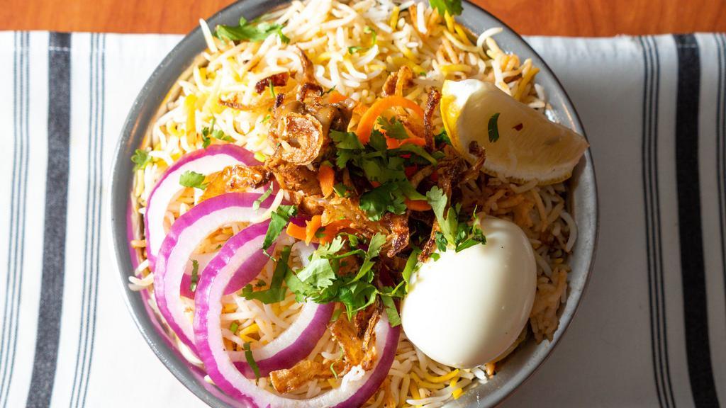 Chicken Dum Biryani · A world famous amazing indian dish. made from hand picked long grain basmati rice and our chef's best hand ground masalas yogurt saffron are cooked in original hyderabadi dum style.