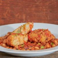 Deconstructed Aloo Tikki · potato patty smothered with garbanzo beans curry served with garlic tamarind and cilantro ch...
