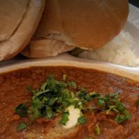 Pav Bhaji · thick potatoes, tomatoes, cauliflower, peas, onion and garlic curry; topped with onions and ...