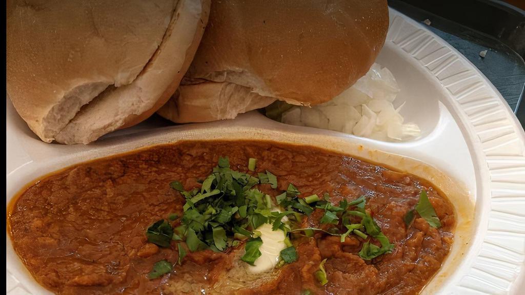 Pav Bhaji · thick potatoes, tomatoes, cauliflower, peas, onion and garlic curry; topped with onions and cilantro; served with buttered bread. add amul cheese for an additional charge.