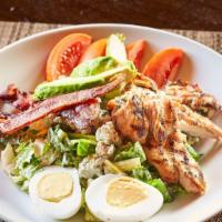 Cobb Salad · Chopped romaine, grilled chicken, hard boiled egg, avocado, blue cheese crumble, bacon and t...