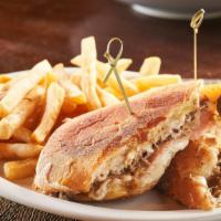 Cuban Sandwich · Pressed ciabatta bread, ham, roast pork, Swiss cheese, pickles, Dijon mustard, and fries.