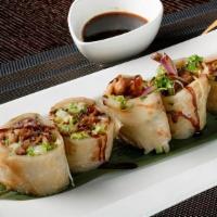 Roasted Duck Roll · Roasted duck, zucchini, lettuce, wrapped with scallion pancake and top drizzled with chef's ...