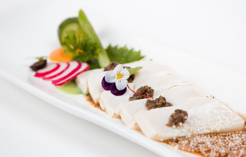 Winter Truffle White Tuna · Seared white tuna, with truffle, black tobiko on top in chef special sauce.