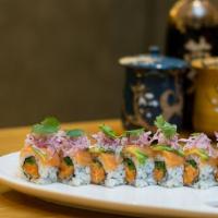 Akio Alaskan Roll · Spicy salmon, cucumber, asparagus inside with salmon, avocado, red onion and cilantro on top.