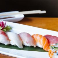 Sushi Regular · 7 pieces assorted sushi with California or tuna roll. Served with miso soup or salad.