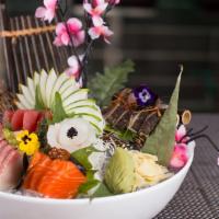 Sashimi Deluxe · 18 pieces assorted fish slice raw fish. Served with miso soup or salad.