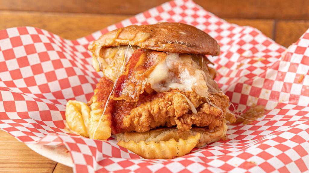 Four Two Zero · Our classic buttermilk crispy chicken, mother’s mac-n-cheese, bacon, caramelized onion, BBQ, French fries.