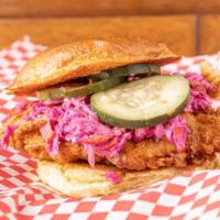 Cluck'N Slaw · Our classic buttermilk crispy chicken w/ our house coleslaw, house pickles.