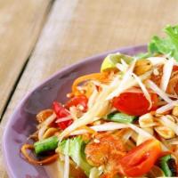 Som Tum (Papaya Salad) · Spicy. The most popular Thai salad chopped papaya, carrot, tomato, shrimp, and peanut tossed...