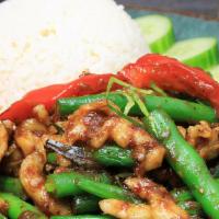 Pad Pik King · Very spicy. Sautéed Thai curry paste, pepper, lemon leaf, and string bean.
