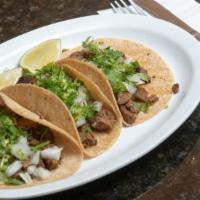 Tacos · Soft corn or flour or hard corn tortilla with your choice of protein and toppings.