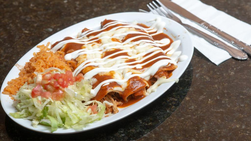 Enchiladas · Three corn tortillas stuffed with your choice of protein and topped with red, green or mole sauce and sour cream and cheese on top.