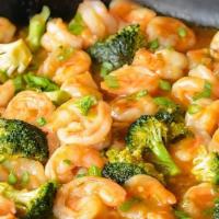 Coconut Curry Spicy Shrimp And Veggies · Shrimp and Veggies (broccoli, peppers and onions) served over Jasmine Rice cover in Spicy Co...