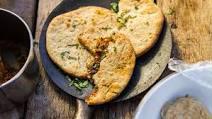 Keema Naan · Our popular naan bread filled with spiced mince meat and baked in a traditional clay oven