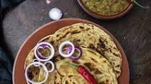 Laccha Paratha  · Layered whole wheat flat bread  baked in a traditional Indian clay oven
