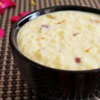 Rice Kheer · Sweet and cream pudding prepared with rice, milk, nuts, raisins &cardamom with a touch of sa...