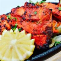 Tandoori Chicken Half · Whole chicken marinated in fresh spices and cooked to perfection.