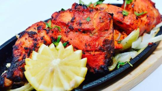 Tandoori Chicken Half · Whole chicken marinated in fresh spices and cooked to perfection.