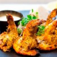 Tandoori Cooked Shrimp · Skewered jumbo shrimp marinated overnight and roasted in the clay oven.