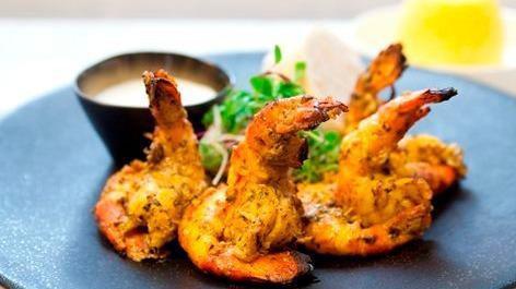 Tandoori Cooked Shrimp · Skewered jumbo shrimp marinated overnight and roasted in the clay oven.