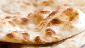 Plain Naan · Clay oven baked bread prepared fresh.