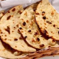 Tandoori Roti Basket · Whole wheat Indian bread baked in clay oven.