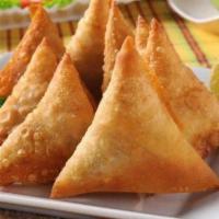 Vegetable Samosa · Crisp friend turnover, filled with delicious, mildly spiced potatoes and green peas.(3pcs).