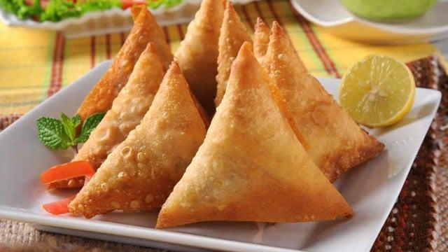 Vegetable Samosa · Crisp friend turnover, filled with delicious, mildly spiced potatoes and green peas.(3pcs).