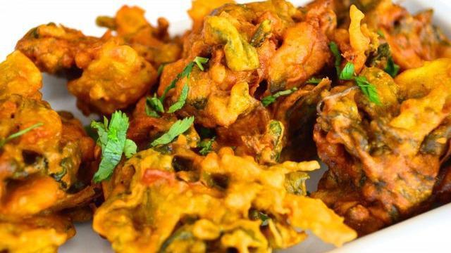 Mixed Vegetable Pakoda · Mixed vegetables dipped in chick pea and rice flour batter deep fried.