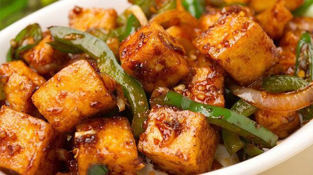Chili Paneer (Burning Tongue) · Slightly battered fried cottage cheese sauteed in spices, chili and herbs.