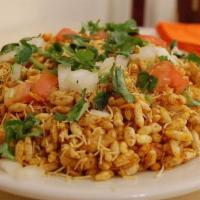 Behl Puri · Puffed rice crisps, potatoes, onions, tomatoes and chutney.