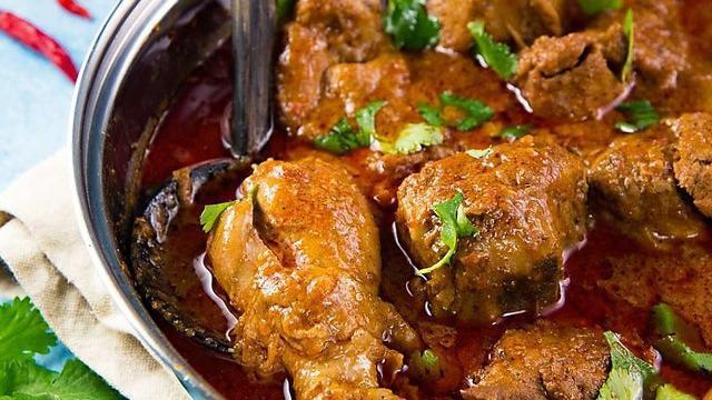 Chicken Curry · Chicken cooked with tomato, onion sauce and spices.