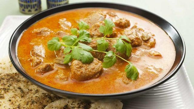 Lamb Curry · Lamb cooked with tomato, onion sauce and spices.