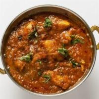 Chicken Vindaloo · Chicken and potatoes cooked in onion and tomato sauce.