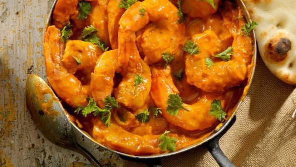Kerala Shrimp Curry · Fresh shrimp prepared with tomato, onion and coconut sauce.