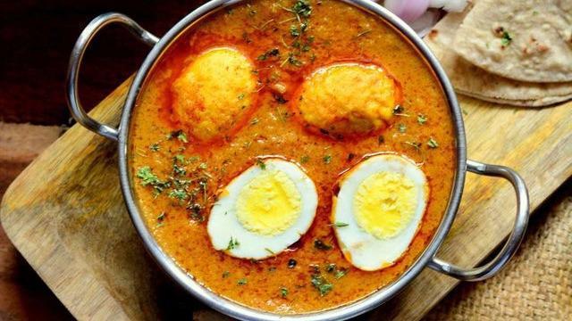 Egg Curry · Boiled eggs cooked with tomatoes, onions and spices.