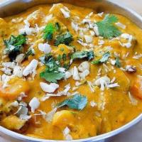 Navaratan Korma · Mixed vegetable cooked in onion, tomatoes, and creamy sauce.