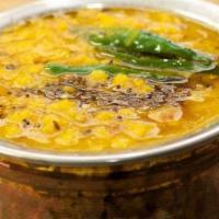 Dal Tadka · Indian lentils cooked in slow flame with fresh vegetable, seasoned with cumin and mustards.