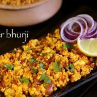 Paneer Bhurji · Scrambled paneer cooked with onions, tomatoes and spices.
